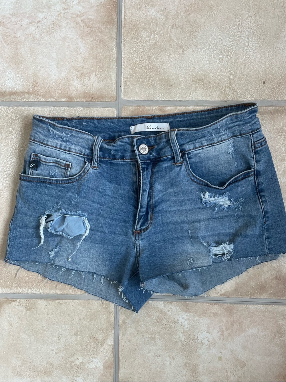 KanCan dark wash low rise distressed denim cut off shorts; size 9 / 28